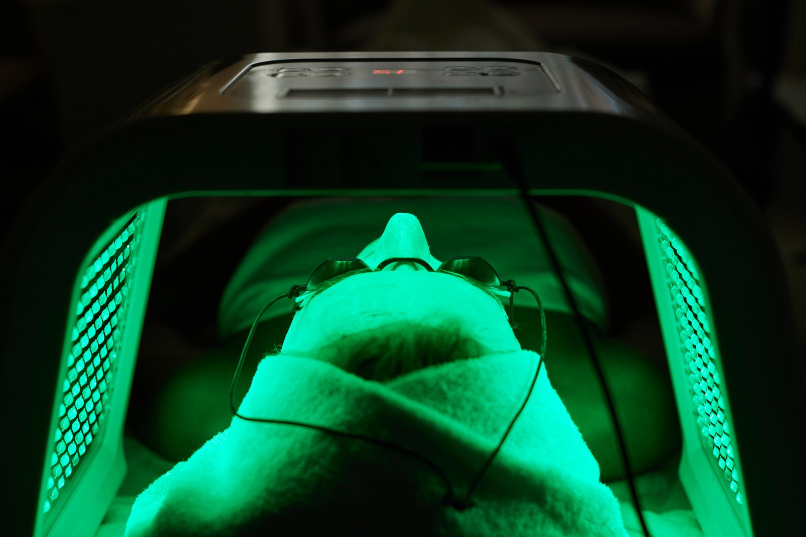 Woman Getting Facial Treatment with Led .